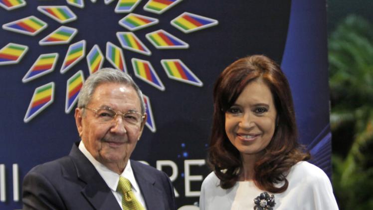 Cuba's President Raul Castro greets Argentina's President Cristina Fernandez to the CELAC Summit in Havana, Cuba, Tuesday, Jan. 28, 2014. Leaders from Latin America and the Caribbean are in Cuba to talk about poverty and inequality at a summit of a regional bloc formed as a force for integration and a counterbalance to the U.S. (AP Photo/ Cubadebate, Ismael Francisco)